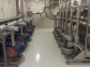 Central vacuum station with two different types of pumps